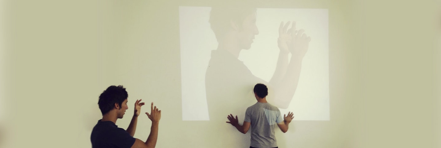 The Stifani brothers experimenting with projected figures during a rehearsal