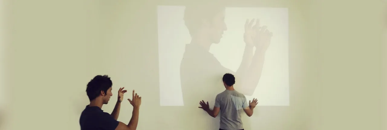 The Stifani brothers experimenting with projected figures during a rehearsal