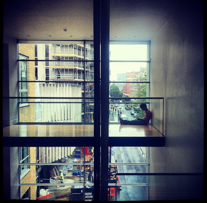 One of the Stifani brothers beside a large window during the creative process